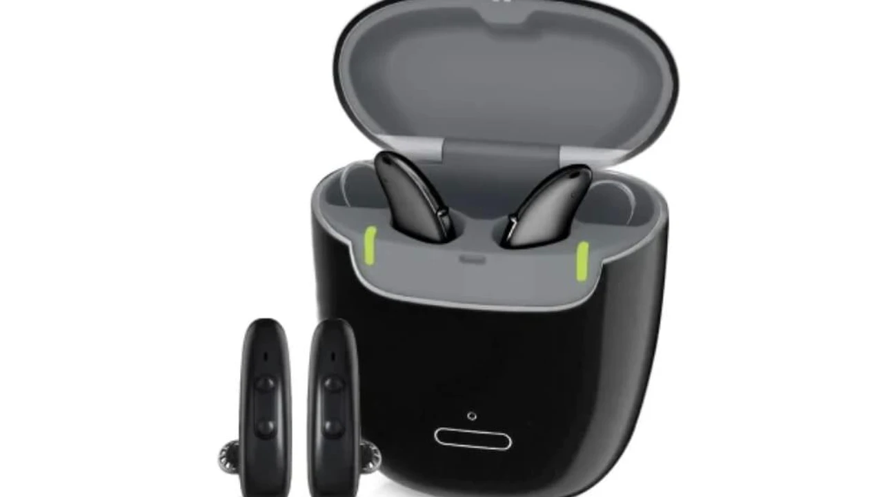 overhead view of corned beef sliced and on a platter with cabbage, potatoes, and carrots