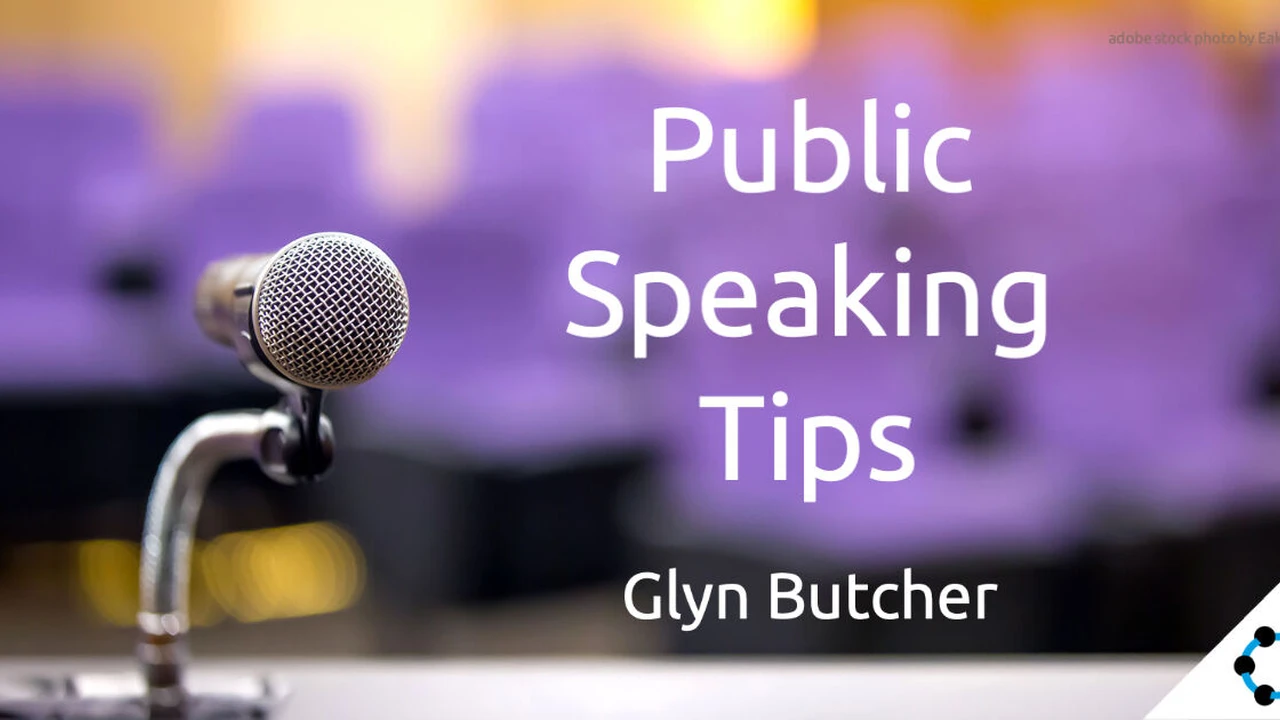 Close up on a plate of mashed potatoes, topped with baked pork chops with cream of mushroom soup, and a side of green beans.
