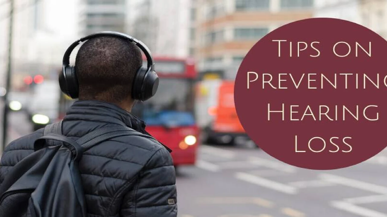 Close up on a plate of mashed potatoes, topped with baked pork chops with cream of mushroom soup, and a side of green beans.