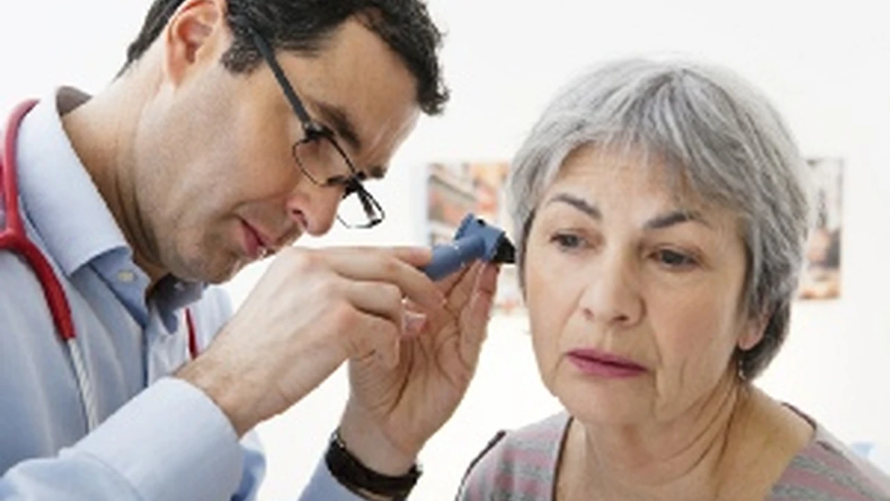 Two mint chocolate milkshakes with whipped cream and green sprinkles.
