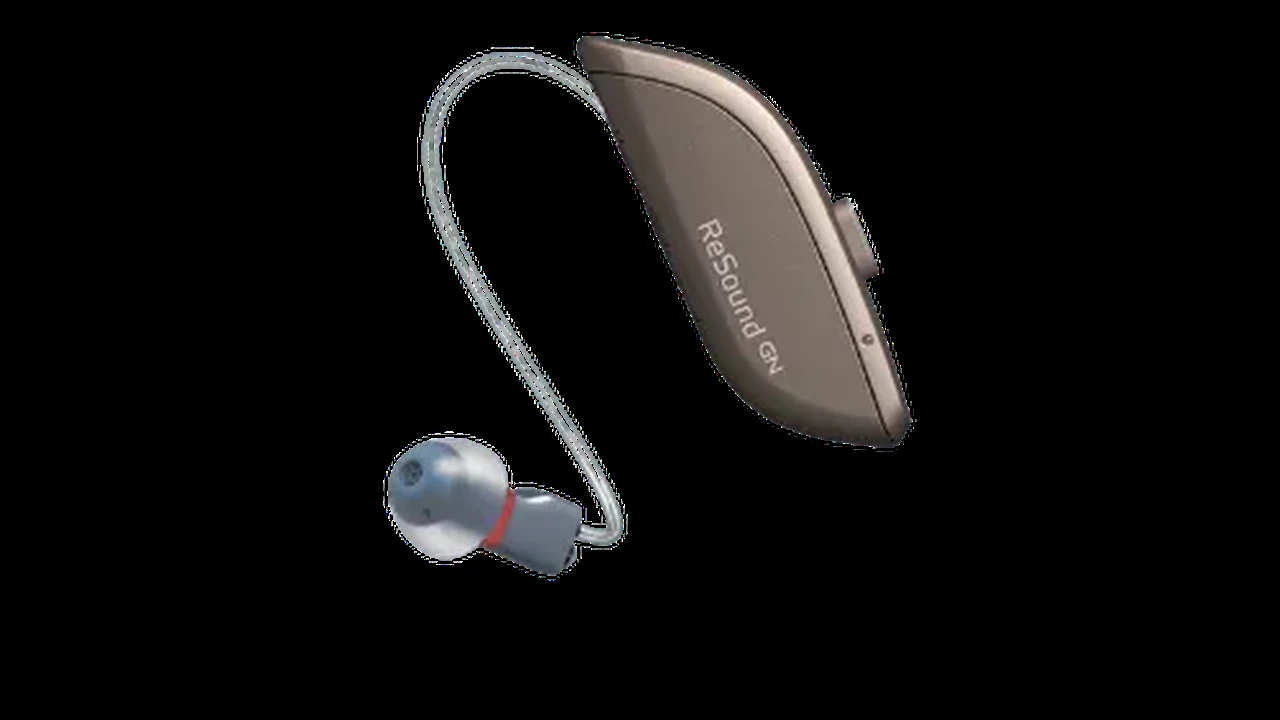 Close up on a plate of mashed potatoes, topped with baked pork chops with cream of mushroom soup, and a side of green beans.